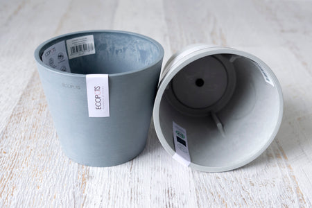 One blue Amsterdam ecopot upright one grey showing interior
