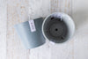 One blue Amsterdam ecopot on the side one grey interior top view