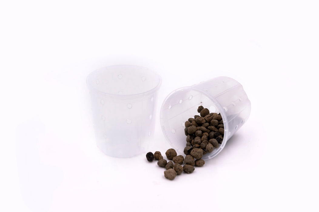 Two clear plastic plant pots with dark clay balls spilling out of one pot