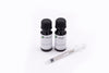 Two Foliage Therapy nutrient bottles with syringe