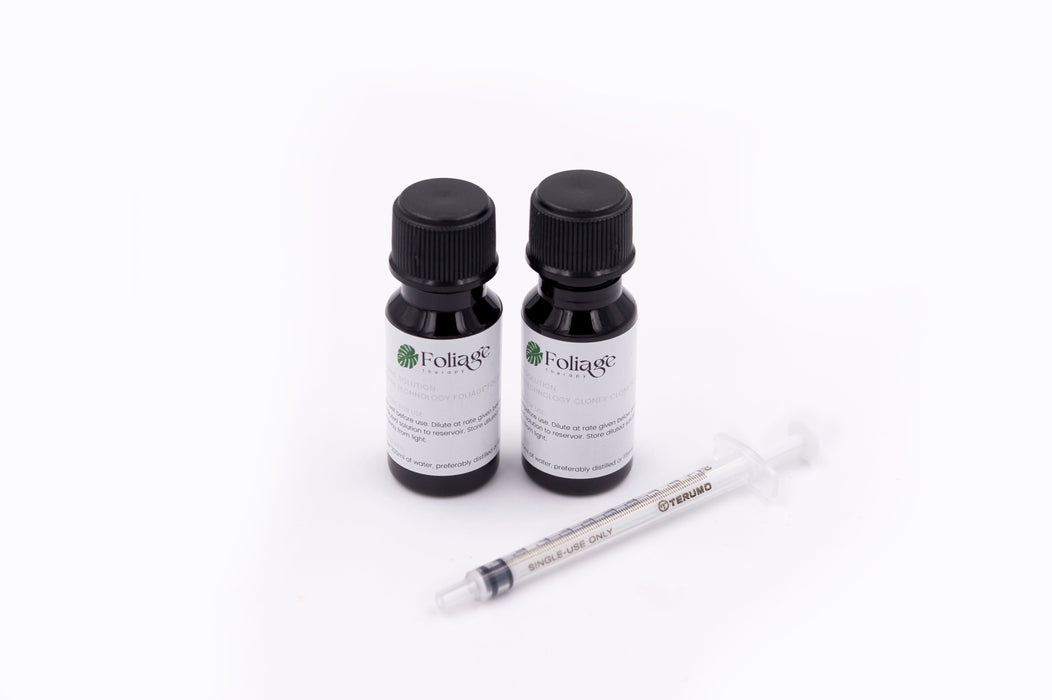 Two Foliage Therapy nutrient bottles with syringe