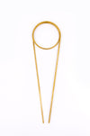 Brass plant totem on white background