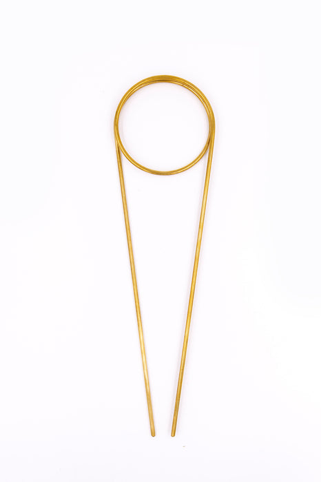 Brass plant totem on white background