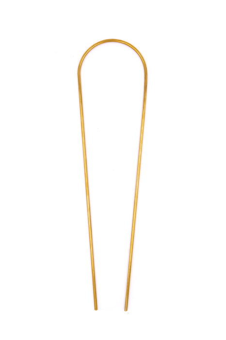 Brass plant totem on white background