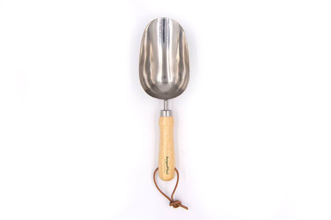 Stainless steel compost scoop with brown leather hanging cord